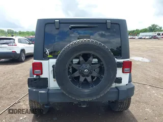2016 Jeep Wrangler Black Bear with VIN 1C4AJWAG7GL106809, listed as a IAAI auction lot 42513015 with 86,730 mi miles and . Bid and sale history available at DreamBid. Image 16.