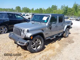 2021 Jeep Gladiator Willys z VIN 1C6HJTAG6ML507039, wystawiony jako IAAI lot #42057637 z przebiegiem 69 443 mil mil oraz . Historia ofert i sprzedaży dostępna na DreamBid. Obrazek 2.