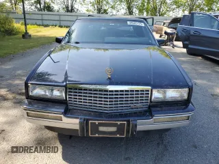 1988 Cadillac Eldorado z VIN 1G6EL1155JU600524, wystawiony jako Copart lot #59505125 z przebiegiem 110 972 mil mil oraz Szkoda całkowita • Salvage title. Historia ofert i sprzedaży dostępna na DreamBid. Obrazek 5.