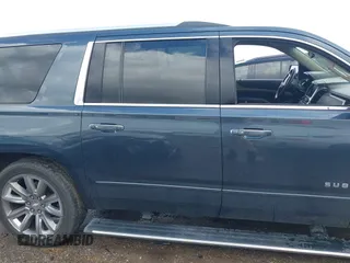 2019 Chevrolet Suburban Premier z VIN 1GNSCJKC0KR139323, wystawiony jako IAAI lot #42100758 z przebiegiem Nie podano mil oraz . Historia ofert i sprzedaży dostępna na DreamBid. Obrazek 13.