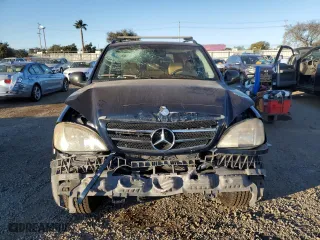 1999 Mercedes-Benz M-Class with VIN 4JGAB54E2XA106113, listed as a Copart auction lot 87996015 with 214,572 mi miles and Salvage Title. Bid and sale history available at carsss.com. Image 5.