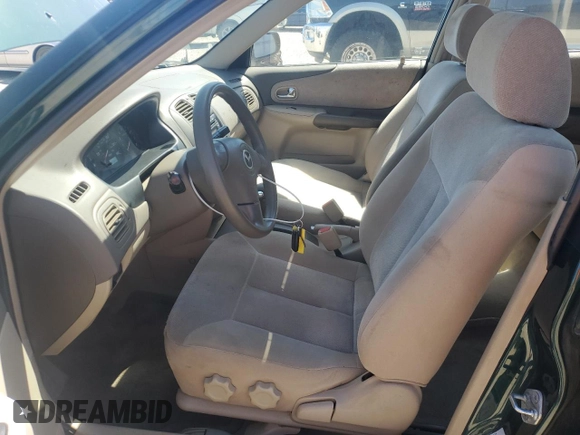 2002 Mazda Protege DX with VIN JM1BJ225121567924, listed as a Copart auction lot 54847545 with 93,653 mi miles and Salvage Title. Bid and sale history available at DreamBid. Image 7.