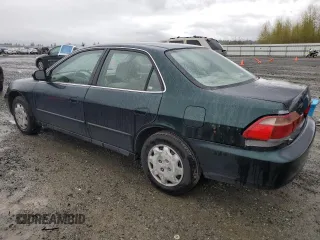 2000 Honda Accord LX z VIN 1HGCG5648YA154043, wystawiony jako Copart lot #51854515 z przebiegiem 176 150 mil mil oraz Szkoda całkowita • Salvage title. Historia ofert i sprzedaży dostępna na DreamBid. Obrazek 2.
