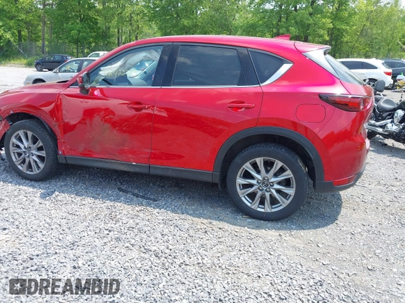 2021 Mazda CX-5 Grand Touring with VIN JM3KFBDM3M0434569, listed as a IAAI auction lot 42422349 with 25,924 mi miles and . Bid and sale history available at DreamBid. Image 14.