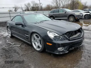 2011 Mercedes-Benz SL 550 with VIN WDBSK7BA8BF165312, listed as a Copart auction lot 51907465 with 32,057 mi miles and Salvage title. Bid and sale history available at DreamBid. Image 4.