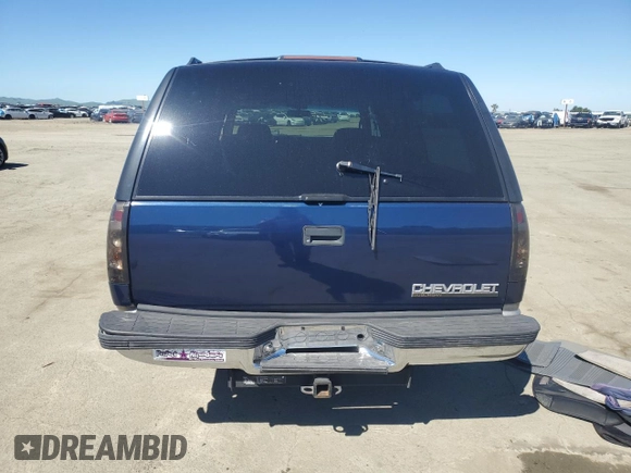 1999 Chevrolet Suburban with VIN 1GNEC16R1XJ394144, listed as a Copart auction lot 50418185 with 173,037 mi miles and Salvage title. Bid and sale history available at DreamBid. Image 6.