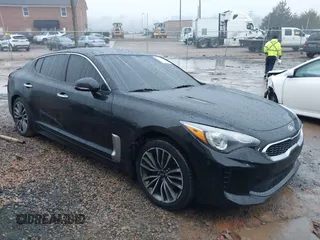 2019 Kia Stinger with VIN KNAE15LA6K6069504, listed as a IAAI auction lot 41031373 with 81,577 mi miles. Bid and sale history available at carsss.com. Image 1.