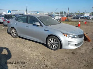 2016 Kia Optima LX z VIN 5XXGT4L36GG018868, wystawiony jako IAAI lot #41896590 z przebiegiem 143 771 mil mil oraz . Historia ofert i sprzedaży dostępna na DreamBid. Obrazek 1.