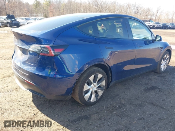 2021 Tesla Model Y Long Range with VIN 5YJYGDEE8MF293230, listed as a IAAI auction lot 41744033 with 56,797 mi miles and . Bid and sale history available at DreamBid. Image 4.