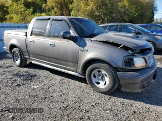 2002 Ford F-150 Harley Davidson with VIN 1FTRW07362KC77880, listed as a Copart auction lot 75259594 with 103,591 mi miles and Salvage Title. Bid and sale history available at carsss.com. Image 4.