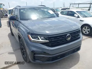 2023 Volkswagen Atlas SEL z VIN 1V2SE2CA9PC218570, wystawiony jako IAAI lot #42627947 z przebiegiem 26 800 mil mil oraz . Historia ofert i sprzedaży dostępna na DreamBid. Obrazek 1.