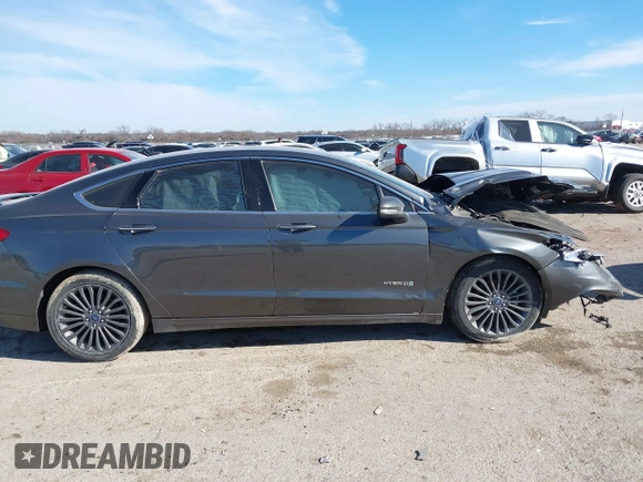 2017 Ford Fusion Hybrid Titanium z VIN 3FA6P0RU0HR314681, wystawiony jako IAAI lot #41288256 z przebiegiem 174 027 mil mil oraz . Historia ofert i sprzedaży dostępna na DreamBid. Obrazek 13.