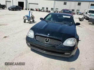 1999 Mercedes-Benz SLK-Class with VIN WDBKK47F5XF129037, listed as a Copart auction lot 68842504 with 74,397 mi miles and Salvage Title. Bid and sale history available at carsss.com. Image 10.