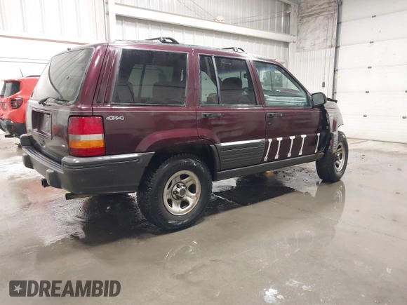 1995 Jeep Grand Cherokee Laredo with VIN 1J4GZ58S2SC679918, listed as a IAAI auction lot 41840415 with 261,434 mi miles. Bid and sale history available at carsss.com. Image 4.