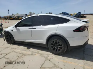2022 Tesla Model X with VIN 7SAXCBE52NF362994, listed as a Copart auction lot 49850475 with 55,506 mi miles and Salvage Title. Bid and sale history available at DreamBid. Image 2.