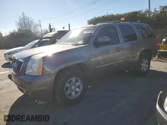 2012 GMC Yukon SLT with VIN 1GKS1CE03CR137258, listed as a Copart auction lot 87684815 with 253,348 mi miles and Salvage Title. Bid and sale history available at carsss.com. Image 1.