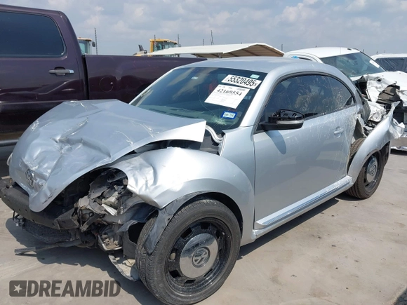 2013 Volkswagen Beetle 2.5L with VIN 3VWJX7AT7DM673319, listed as a IAAI auction lot 42169554 with 128,622 mi miles and . Bid and sale history available at DreamBid. Image 18.