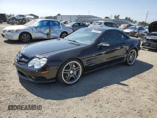 2005 Mercedes-Benz SL 55 AMG with VIN WDBSK74F95F087653, listed as a Copart auction lot 62196015 with 73,327 mi miles and Salvage title. Bid and sale history available at DreamBid. Image 1.