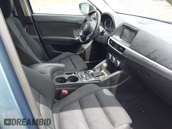 2016 Mazda CX-5 Touring z VIN JM3KE2CY3G0728968, wystawiony jako IAAI lot #42189174 z przebiegiem 145 977 mil mil oraz . Historia ofert i sprzedaży dostępna na DreamBid. Obrazek 5.