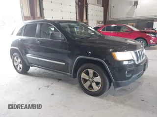 2012 Jeep Grand Cherokee Laredo with VIN 1C4RJFAT8CC182128, listed as a IAAI auction lot 40154044 with 239,601 mi miles. Bid and sale history available at carsss.com. Image 1.