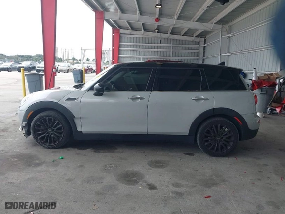 2019 MINI Cooper Clubman with VIN WMWLN5C53K2E34830, listed as a IAAI auction lot 41419983 with 64,716 mi miles. Bid and sale history available at carsss.com. Image 14.