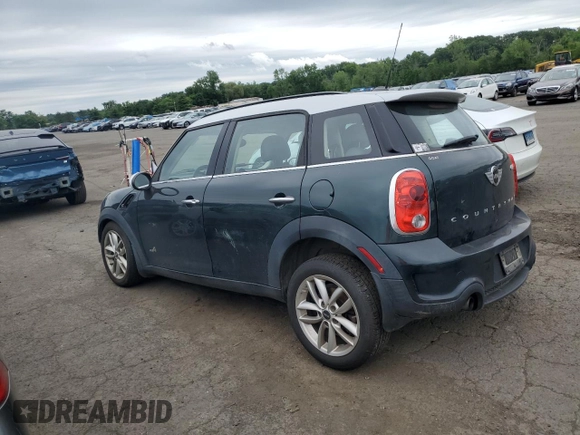 2014 MINI Countryman S with VIN WMWZC5C58EWP39797, listed as a Copart auction lot 62193515 with 84,989 mi miles and Salvage title. Bid and sale history available at DreamBid. Image 2.