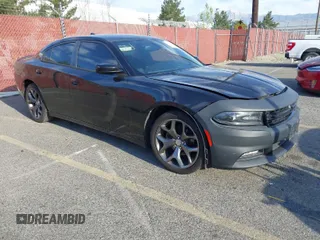 2015 Dodge Charger SXT with VIN 2C3CDXHG9FH915191, listed as a IAAI auction lot 41850427 with 164,535 mi miles and . Bid and sale history available at DreamBid. Image 1.
