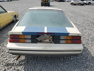 1987 Chevrolet Camaro z VIN 1G1FP21H6HL111063, wystawiony jako Copart lot #59387995 z przebiegiem 63 289 mil mil oraz Czysty tytuł • Clean title. Historia ofert i sprzedaży dostępna na DreamBid. Obrazek 6.