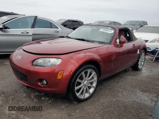 2007 Mazda MX-5 Miata Sport z VIN JM1NC25F870128289, wystawiony jako Copart lot #74999014 z przebiegiem 42 875 mil mil oraz Nie do naprawy. Historia ofert i sprzedaży dostępna na DreamBid. Obrazek 1.