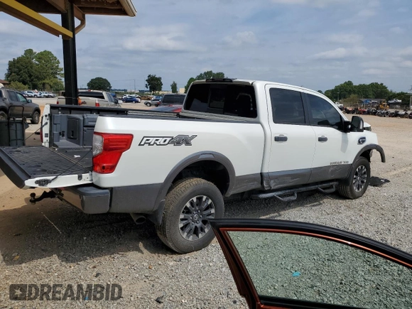 2018 Nissan Titan Platinum Reserve with VIN 1N6BA1F49JN521225, listed as a Copart auction lot 69831004 with 92,536 mi miles and Salvage title. Bid and sale history available at DreamBid. Image 3.