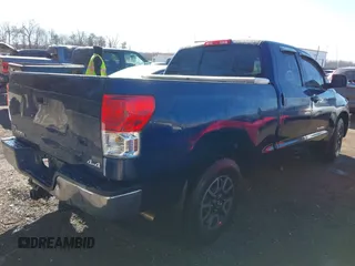 2013 Toyota Tundra z VIN 5TFUM5F14DX043076, wystawiony jako IAAI lot #41633905 z przebiegiem 157 850 mil mil oraz . Historia ofert i sprzedaży dostępna na DreamBid. Obrazek 4.