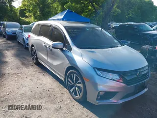 2018 Honda Odyssey Elite z VIN 5FNRL6H97JB051048, wystawiony jako IAAI lot #42393303 z przebiegiem 42 473 mil mil oraz . Historia ofert i sprzedaży dostępna na DreamBid. Obrazek 1.