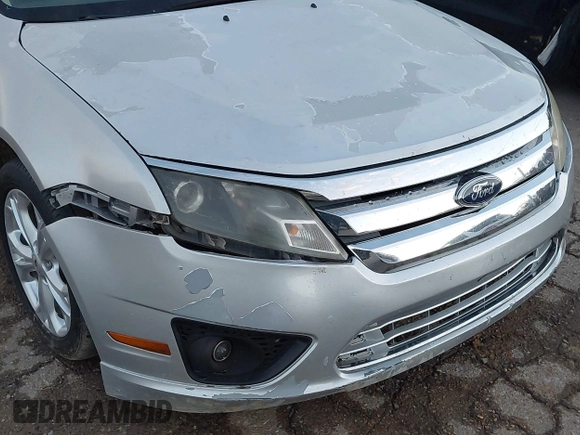 2012 Ford Fusion SE z VIN 3FAHP0HA4CR213409, wystawiony jako IAAI lot #41079155 z przebiegiem 139 129 mil mil oraz . Historia ofert i sprzedaży dostępna na DreamBid. Obrazek 6.