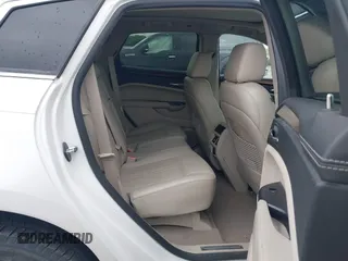 2013 Cadillac SRX Performance Collection z VIN 3GYFNHE35DS569528, wystawiony jako IAAI lot #42329652 z przebiegiem 97 184 mil mil oraz . Historia ofert i sprzedaży dostępna na DreamBid. Obrazek 8.