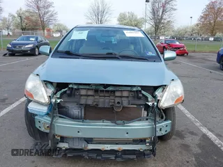 2009 Toyota Yaris with VIN JTDBT903794060474, listed as a IAAI auction lot 42005903 with 104,607 mi miles. Bid and sale history available at carsss.com. Image 12.