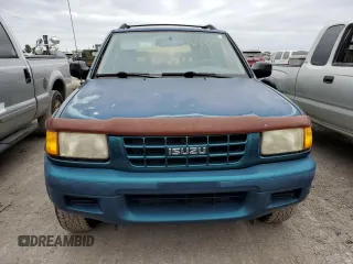 1999 Isuzu Rodeo S with VIN 4S2CK58W9X4322074, listed as a Copart auction lot 76999244 with 110,142 mi miles and Salvage Title. Bid and sale history available at carsss.com. Image 5.