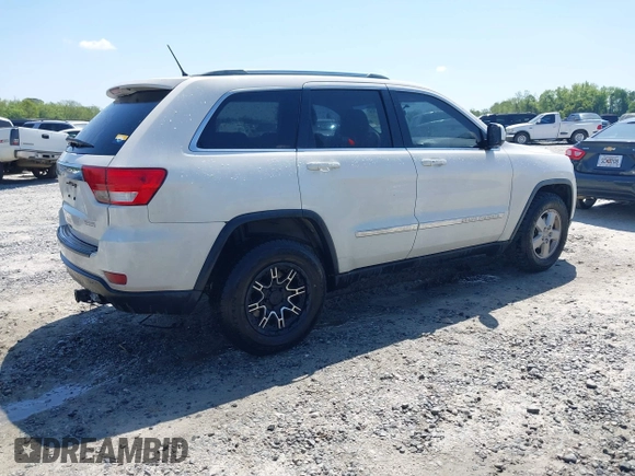 2011 Jeep Grand Cherokee Laredo with VIN 1J4RS4GG5BC573337, listed as a IAAI auction lot 41960369 with 185,518 mi miles and . Bid and sale history available at DreamBid. Image 4.