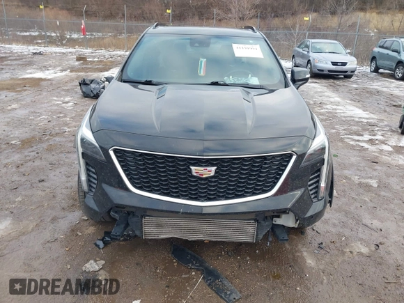 2021 Cadillac XT4 AWD Sport with VIN 1GYFZFR49MF065225, listed as a IAAI auction lot 41191994 with 58,095 mi miles and . Bid and sale history available at DreamBid. Image 6.