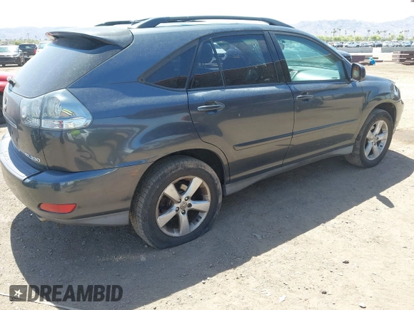 2004 Lexus RX 330 with VIN JTJGA31U340001595, listed as a IAAI auction lot 42125099 with 238,834 mi miles. Bid and sale history available at carsss.com. Image 4.