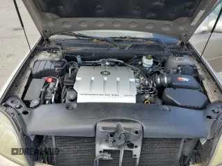 2004 Cadillac DeVille DTS z VIN 1G6KF579X4U212415, wystawiony jako Copart lot #58005555 z przebiegiem 97 663 mil mil oraz Tytuł czysty. Historia ofert i sprzedaży dostępna na DreamBid. Obrazek 11.