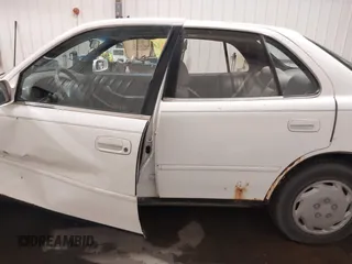1995 Toyota Camry LE z VIN JT2SK12E8S0299203, wystawiony jako IAAI lot #39607993 z przebiegiem 193 374 mil mil oraz . Historia ofert i sprzedaży dostępna na DreamBid. Obrazek 14.