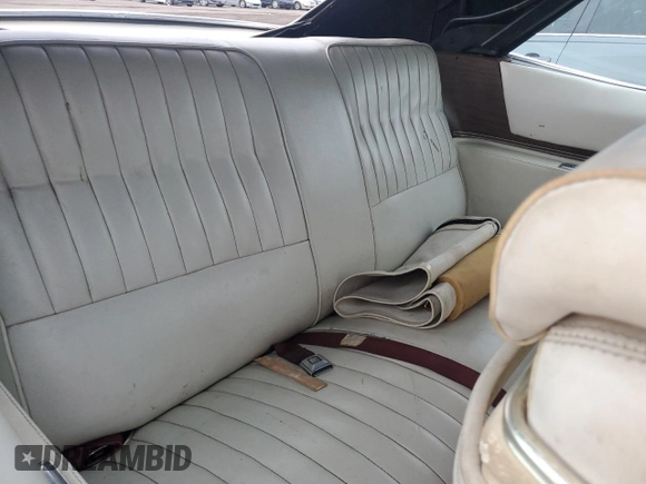 1974 Cadillac Eldorado z VIN 6L67S4Q408046, wystawiony jako Copart lot #77112024 z przebiegiem 97 414 mil mil oraz Szkoda całkowita • Salvage title. Historia ofert i sprzedaży dostępna na DreamBid. Obrazek 10.