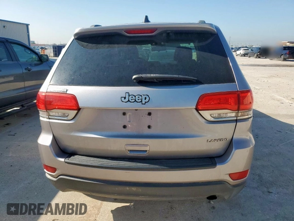 2014 Jeep Grand Cherokee Laredo with VIN 1C4RJEAG4EC182773, listed as a Copart auction lot 54085255 with 138,775 mi miles and Salvage Title. Bid and sale history available at DreamBid. Image 6.