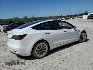 2023 Tesla Model 3 with VIN 5YJ3E1EA9PF558088, listed as a Copart auction lot 52228465 with 63,204 mi miles and Salvage title. Bid and sale history available at DreamBid. Image 3.