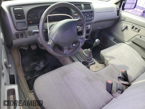 1999 Nissan Frontier XE with VIN 1N6DD21S9XC312809, listed as a Copart auction lot 57702005 with 174,183 mi miles and Clean title. Bid and sale history available at DreamBid. Image 8.