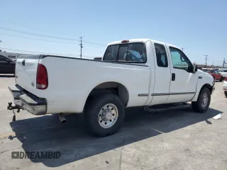 1999 Ford F-250 XL with VIN 1FTNX20L8XEB01923, listed as a Copart auction lot 65404495 with 383,297 mi miles and Salvage title. Bid and sale history available at DreamBid. Image 3.