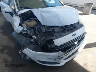 2014 Ford Fiesta SE z VIN 3FADP4EJ4EM117919, wystawiony jako IAAI lot #42262361 z przebiegiem 121 141 mil mil oraz . Historia ofert i sprzedaży dostępna na DreamBid. Obrazek 6.