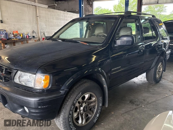 2002 Isuzu Rodeo S with VIN 4S2CK58W124336947, listed as a Copart auction lot 63482935 with 248,008 mi miles and Clean title. Bid and sale history available at DreamBid. Image 2.