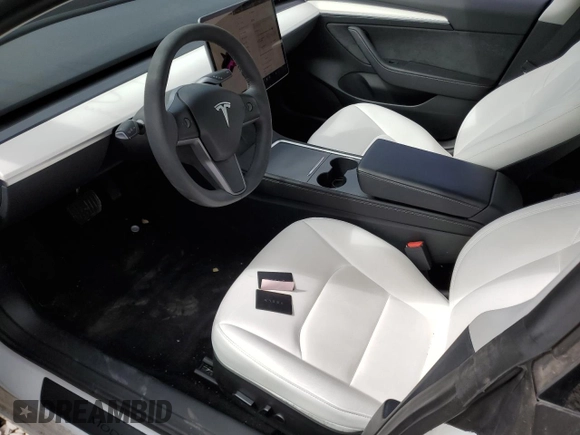 2023 Tesla Model 3 with VIN 5YJ3E1EA9PF569835, listed as a Copart auction lot 50876824 with 25,736 mi miles and Salvage Title. Bid and sale history available at DreamBid. Image 7.