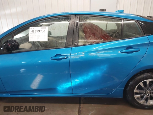 2021 Toyota Prius L Eco with VIN JTDKAMFU9M3135117, listed as a IAAI auction lot 41579736 with 35,795 mi miles and . Bid and sale history available at DreamBid. Image 15.